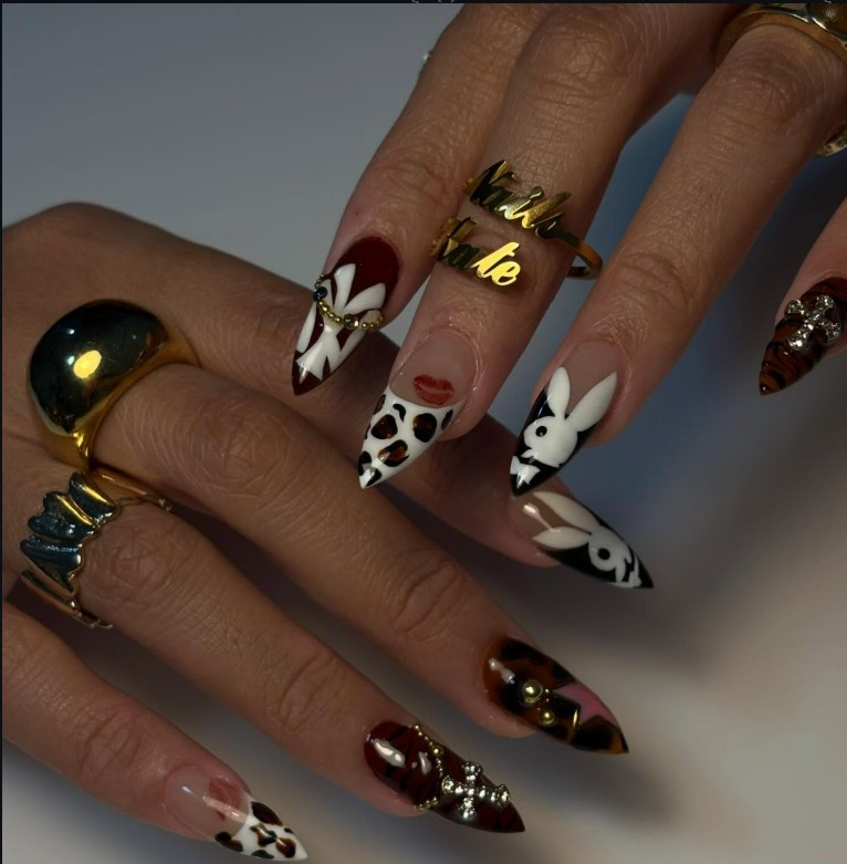 Playboy bunny and leopard print nail art in burgundy and white