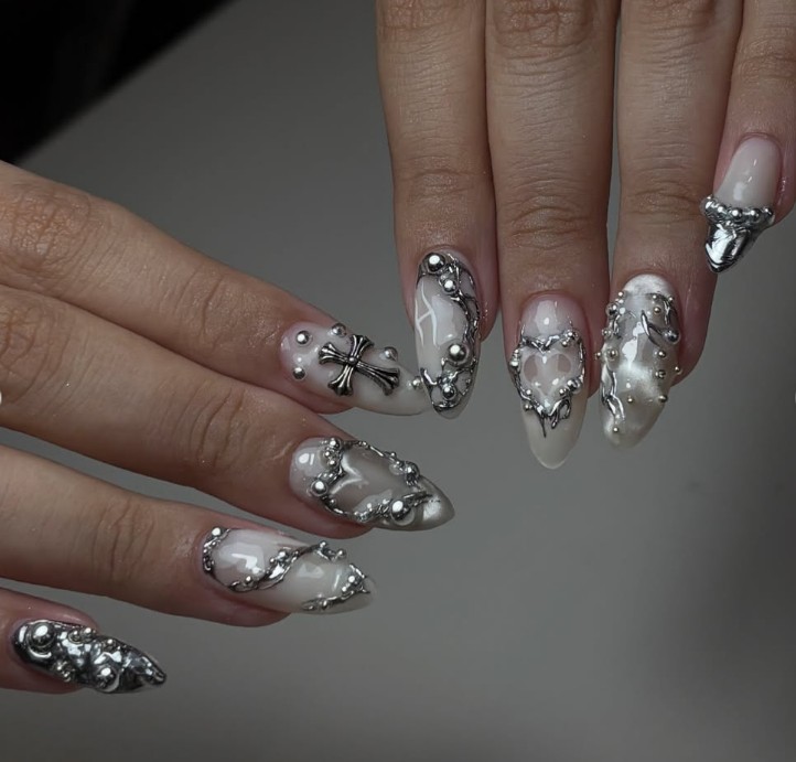 Chrome silver nail art with crosses and hearts