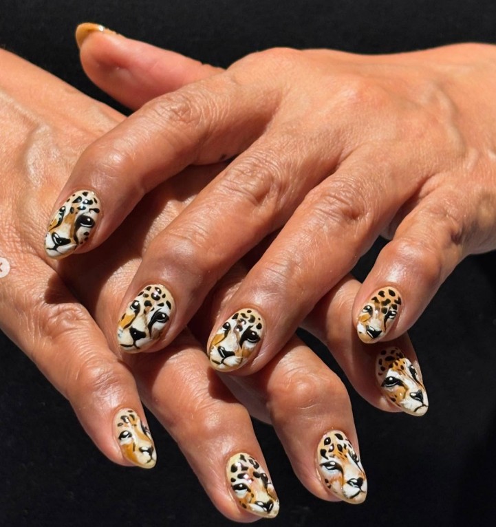 Hand-painted cheetah face nail art